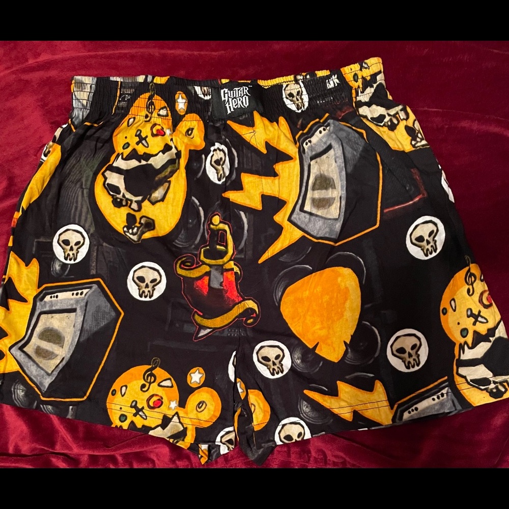 Guitar Hero Men’s Sleep Short in a guitar case